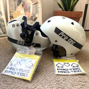 Two white Pro Tec helmets
